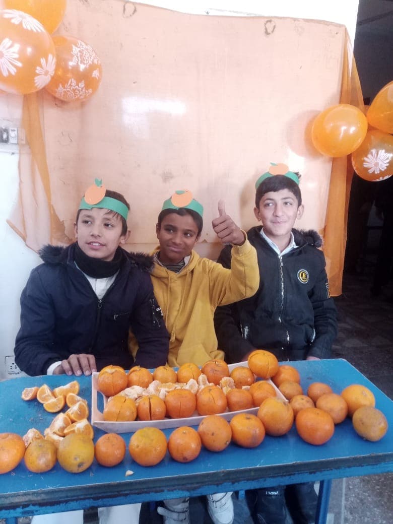 Students displaying their work at Hassan Academy